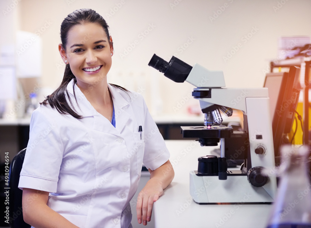 Specializing in scientific research. Portrait of a confident young scientist working in a laboratory