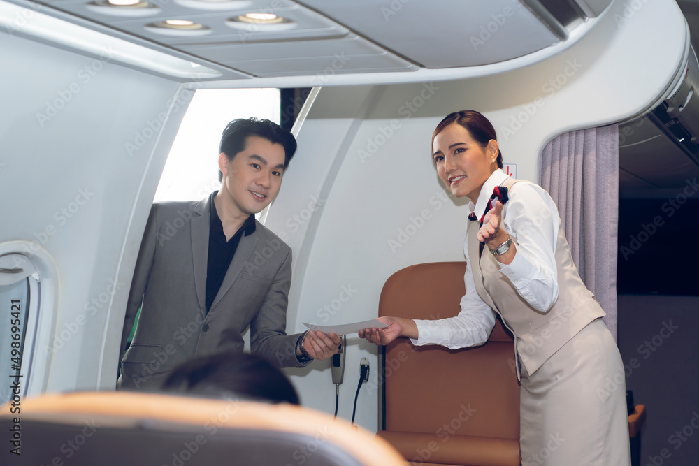 Stewardess attendant  passengers on airplane