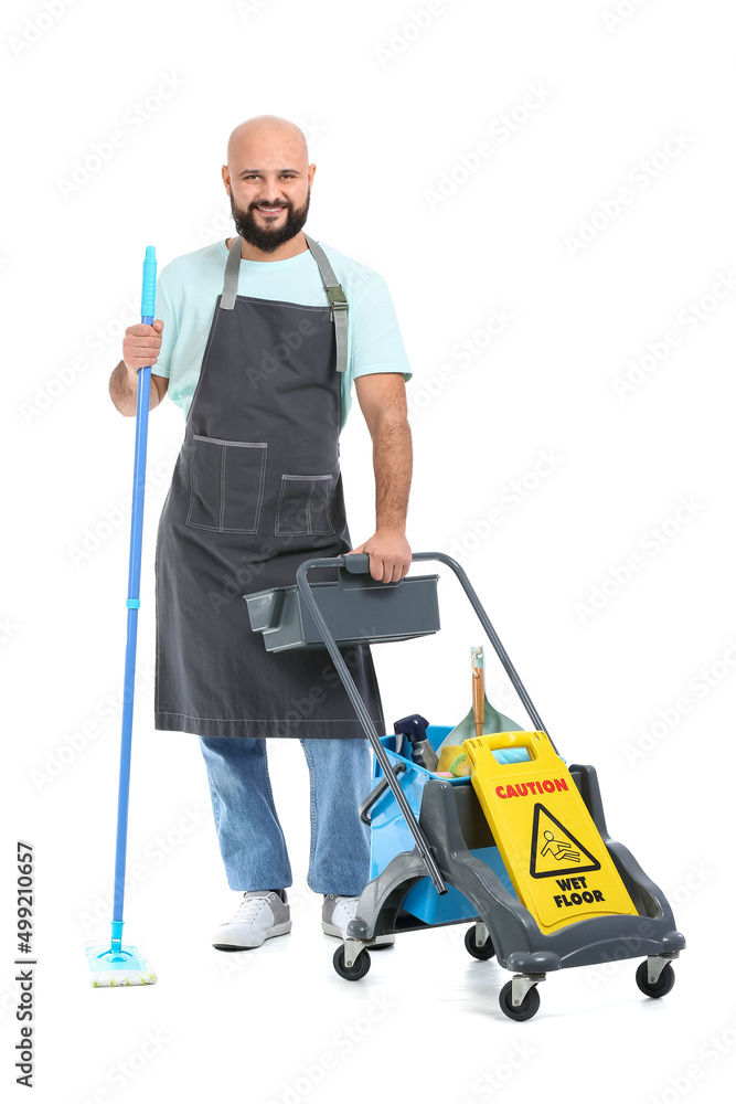 Male worker of cleaning service with trolley on white background