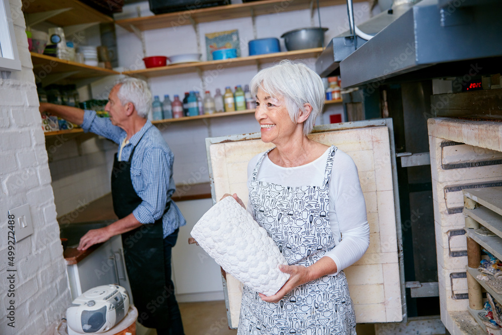 Home is where the art is. Shot of a senior couple working with ceramics in a workshop.