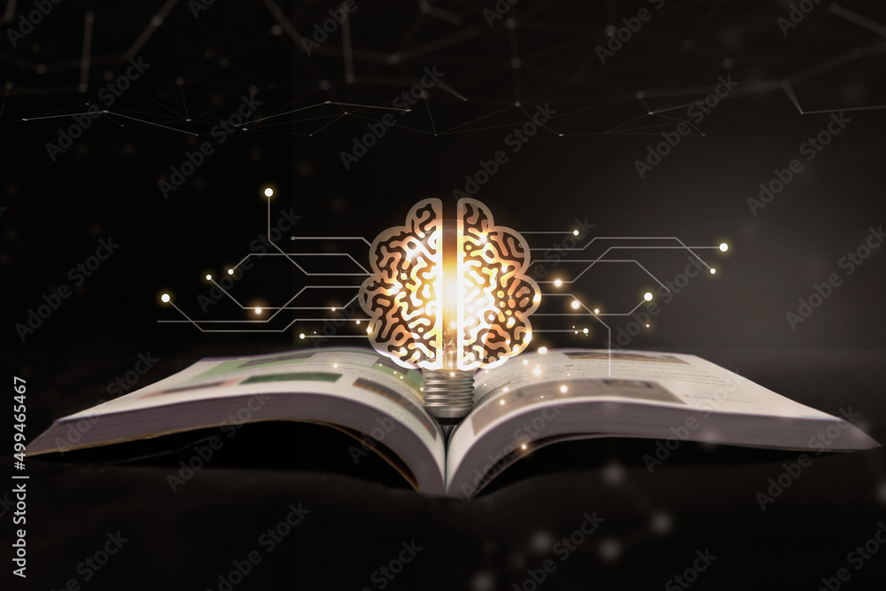 灯泡里闪烁着书籍的光芒。阅读书籍、知识和寻找新想法的想法。