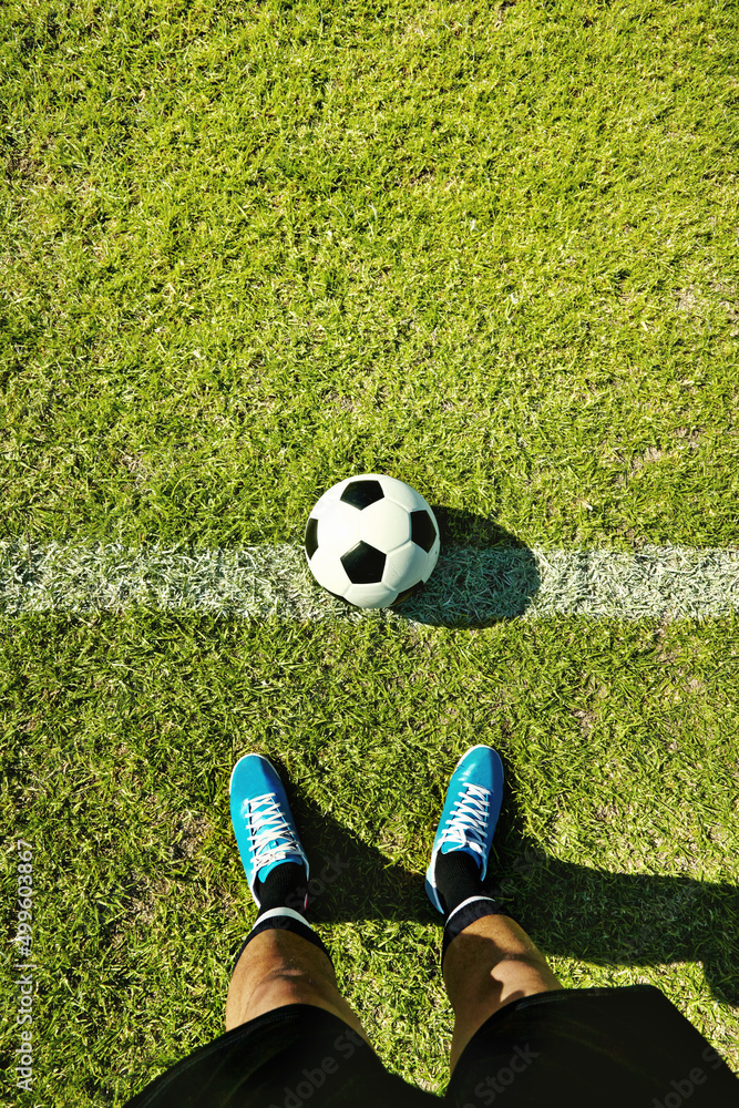 Ready for kick-off. POV shot of a soccer player standing on the field.