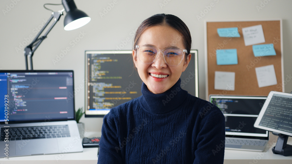 Portrait young Asian woman developer programmer, software engineer, IT support, wearing glasses look