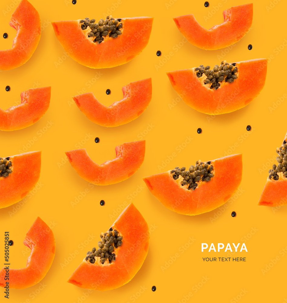 Creative layout made of papaya. Flat lay. Food concept. Papaya on the orange background.
