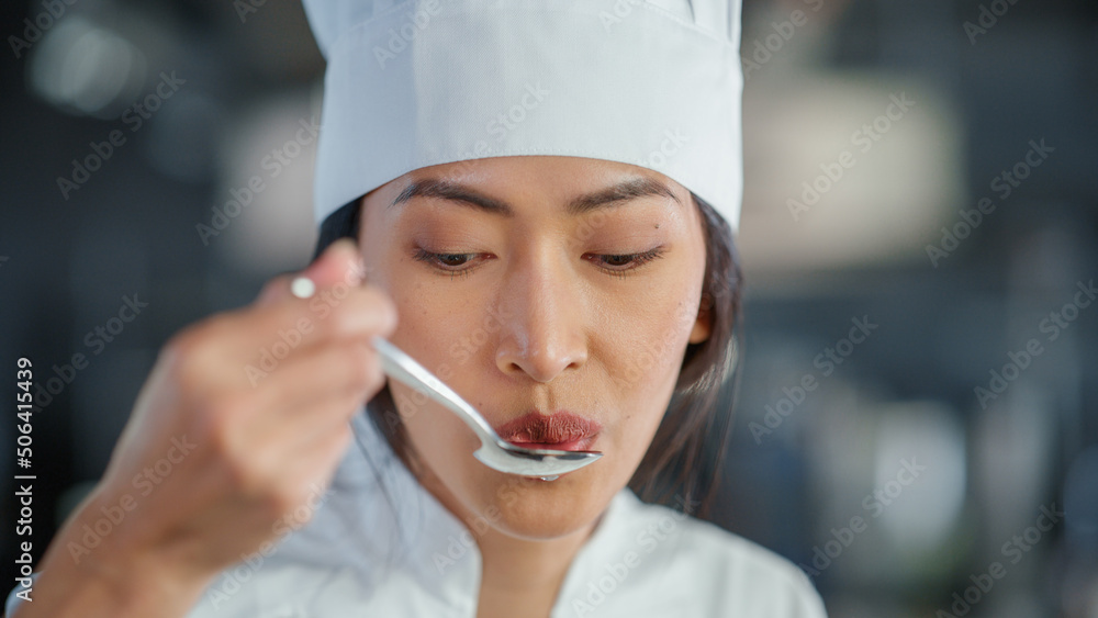 World Famous Restaurant: Portrait of Smiling Asian Female Chef Cooking Delicious, Steamy, Authentic 