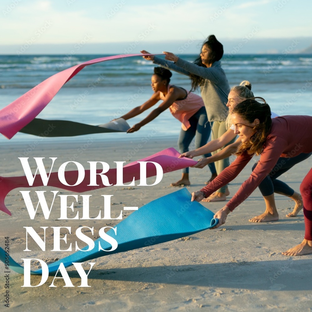 世界健康日文本，多种族年轻女性在海滩的沙滩上放运动垫