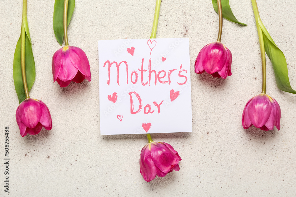 Card with text MOTHERS DAY and pink tulips on light background