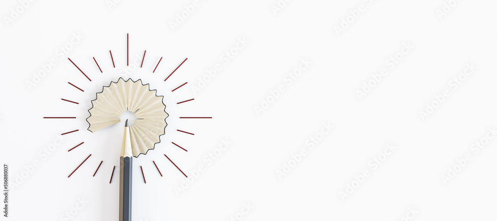 Blank white background with copyspace for your logo and pencil shavings veiled under glowing light b