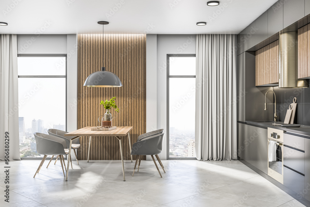 阳光明媚的时尚厨房区域内的木制餐桌和灰色椅子侧视图，配有陶瓷地板