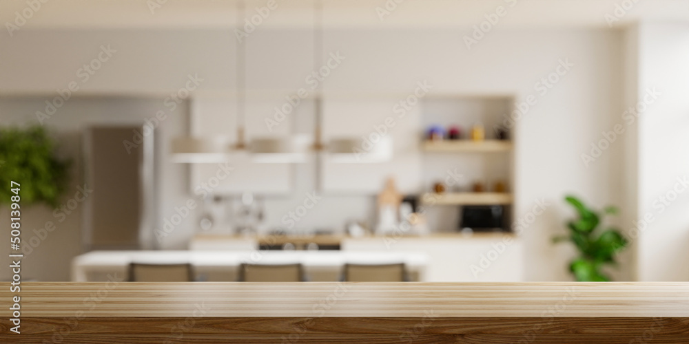 模糊厨房背景上的木制桌面，现代现代厨房室内。