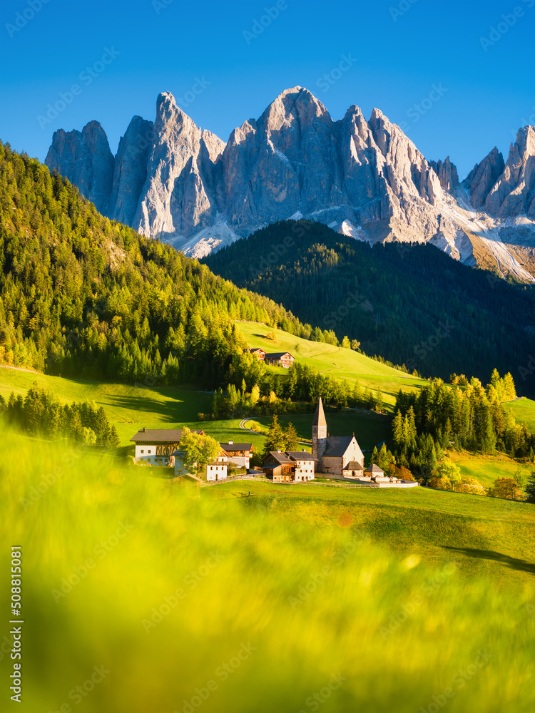 Santa Maddalena. Val di Funes. Dolomite Alps. Italy. The mountains and the forest before sunset. Nat