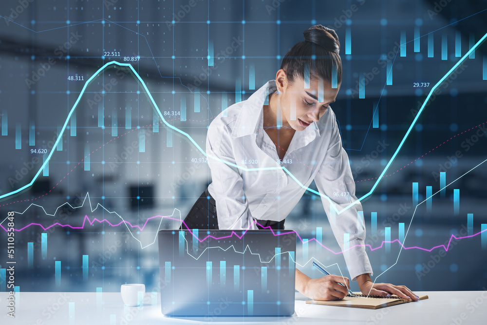  businesswoman standing at desktop using laptop with abstract glowing forex graph on blurry office i
