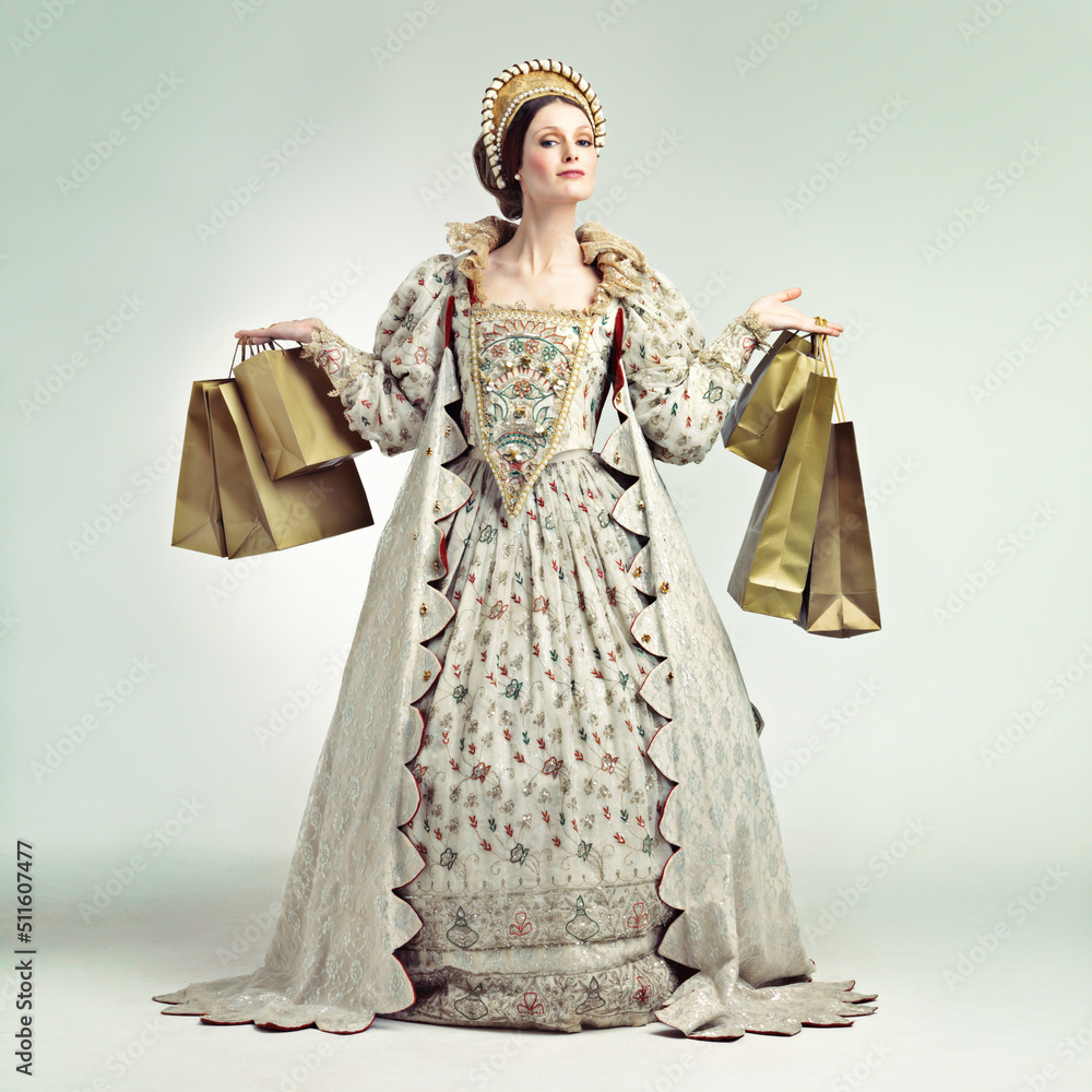 Royal shopping spree. A gorgeous Victorian queen holding parcels.