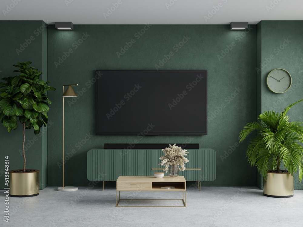 绿色墙壁背景的电视室，带电视柜的现代客厅装饰。