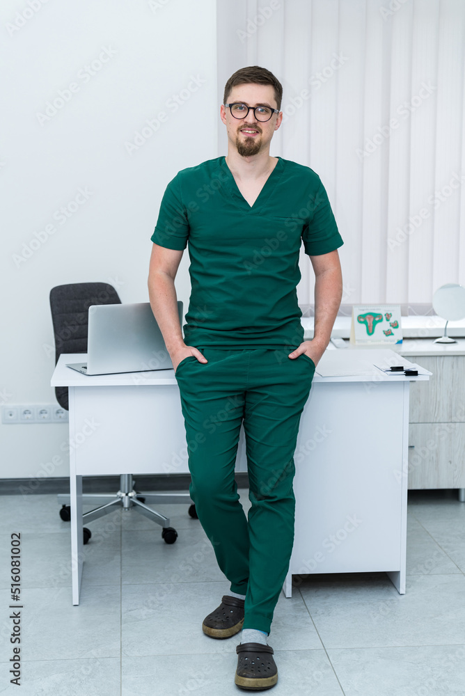 Portrait of handsome medical worker in uniform. Professional confident medical specialist.