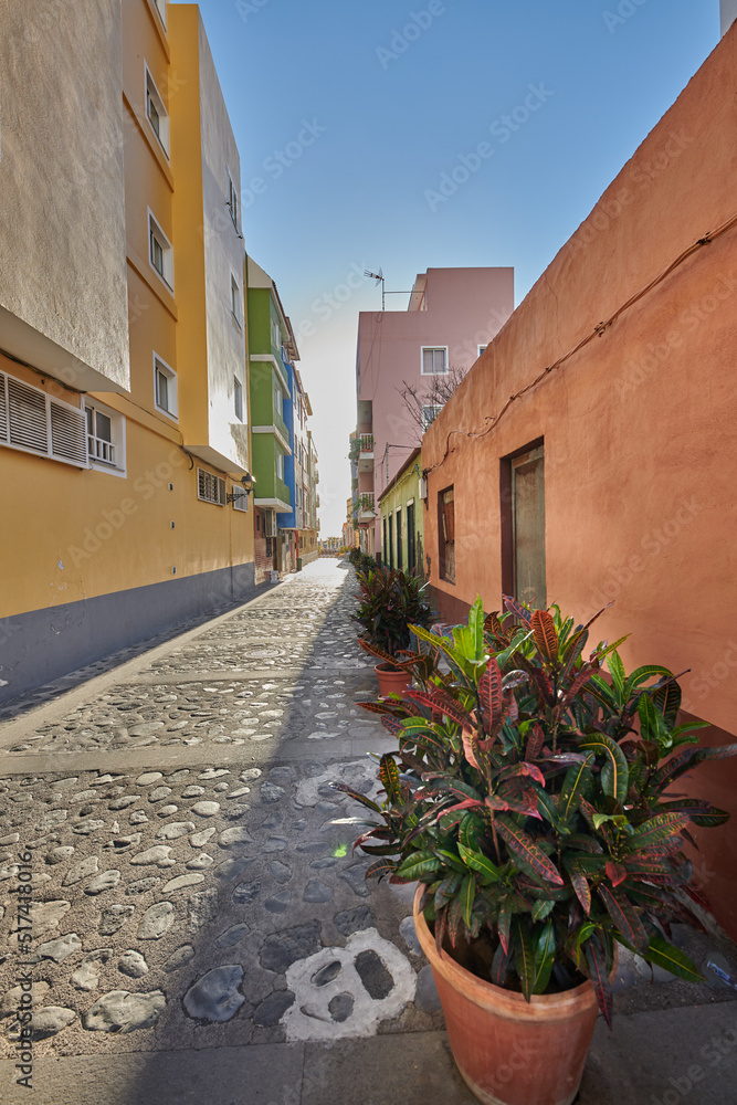City view of residential houses or buildings in quiet alleyway street in Santa Cruz, La Palma, Spain