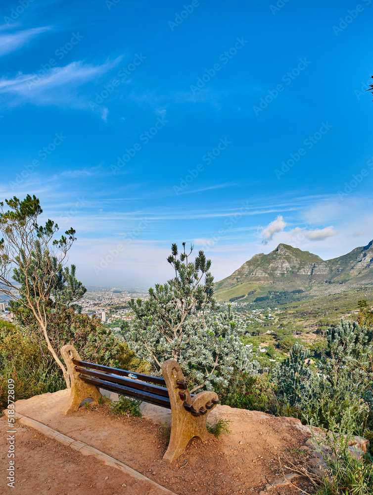 Bench with a beautiful view of Table Mountain and sea against a clear blue sky background with copy 