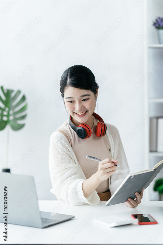 Education online learning or self study concept. young asian girl do researching and finding from bo