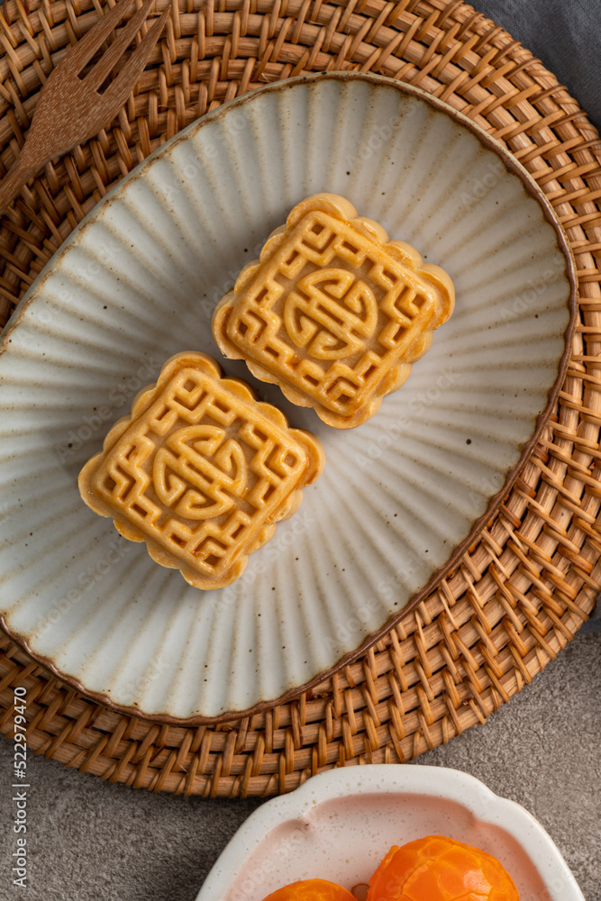 Delicious mung bean moon cake for Mid-Autumn Festival food mooncake on gray table background.