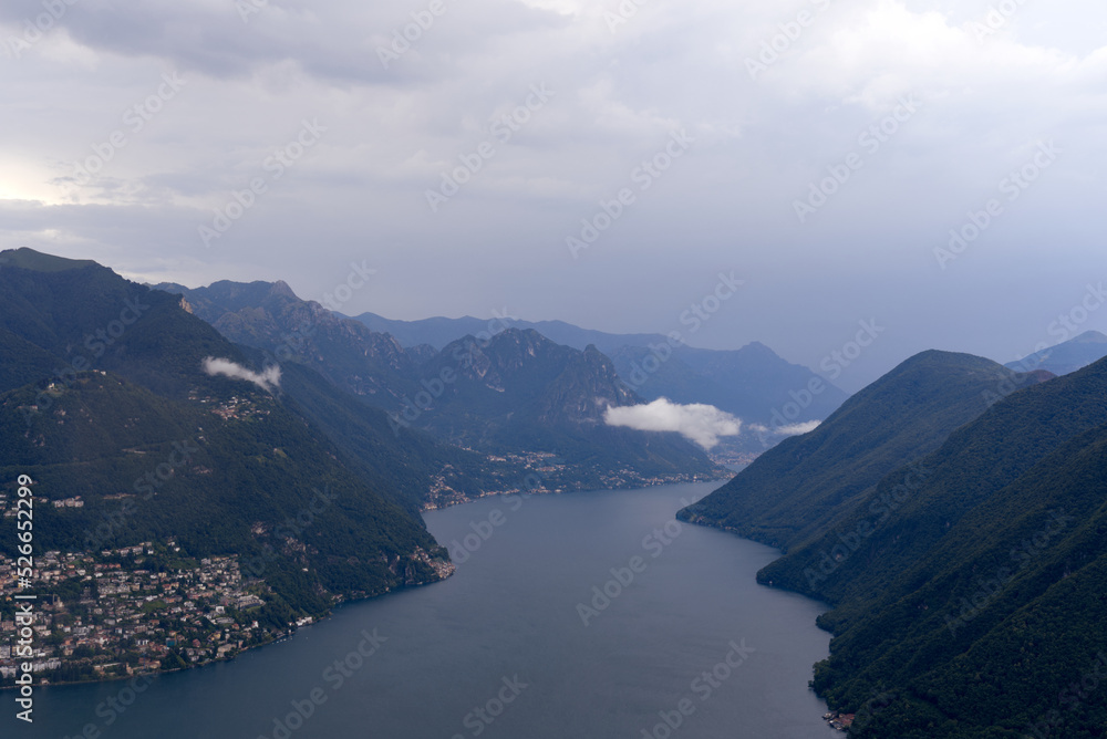 Aerial view from local mountain San Salvatore over region of Lugano, Canton Ticino, with Lake Lugano