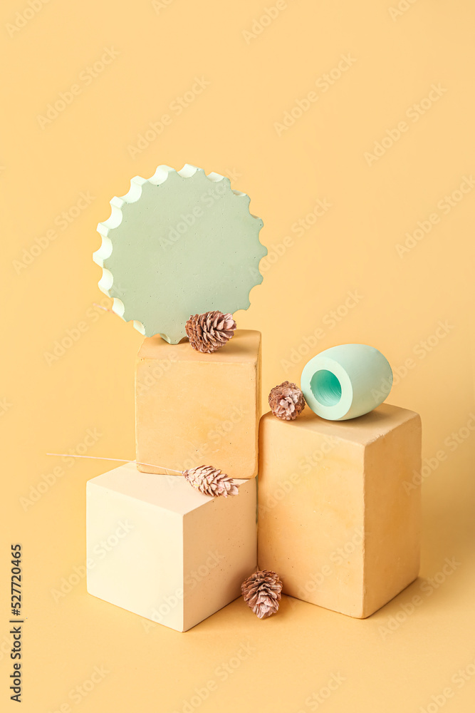 Composition with showcase pedestal and floral decor on color background