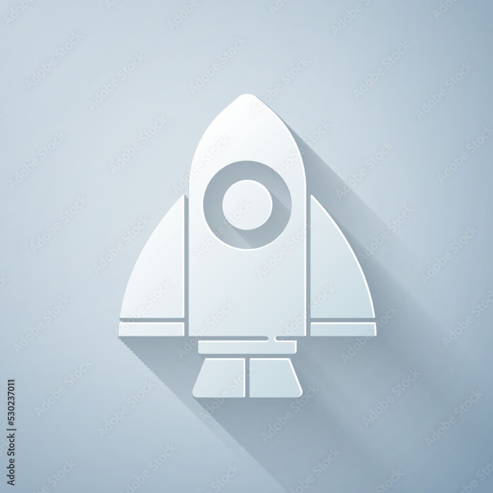 Paper cut Rocket ship icon isolated on grey background. Space travel. Paper art style. Vector