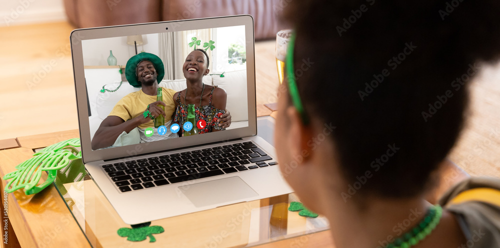 African american woman having a video call on laptop at home