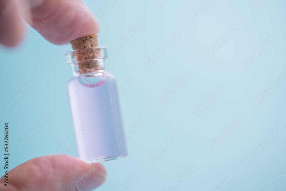 Small bottle with aromatic perfume with pheramones