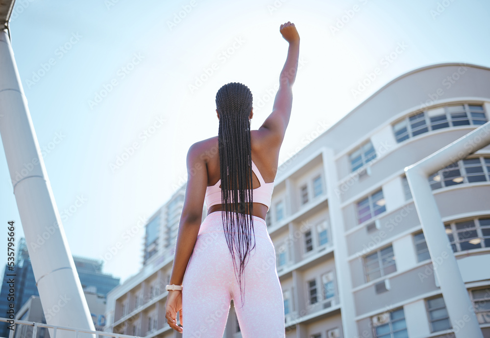Strong, empowerment and black woman for fitness, exercise and workout outside in city showing fist, 