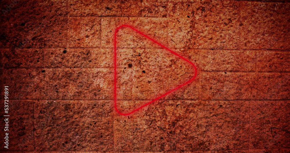 Composite of red play button icon against abandoned old wall, copy space