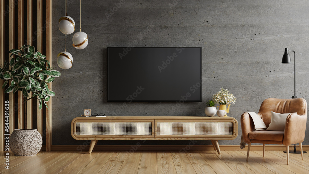 现代客厅混凝土墙的木质橱柜和皮扶手椅上的电视。