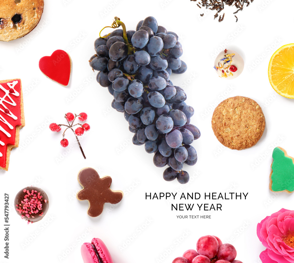 由葡萄、饼干、柠檬、巧克力和干茶制成的创意快乐健康新年贺卡