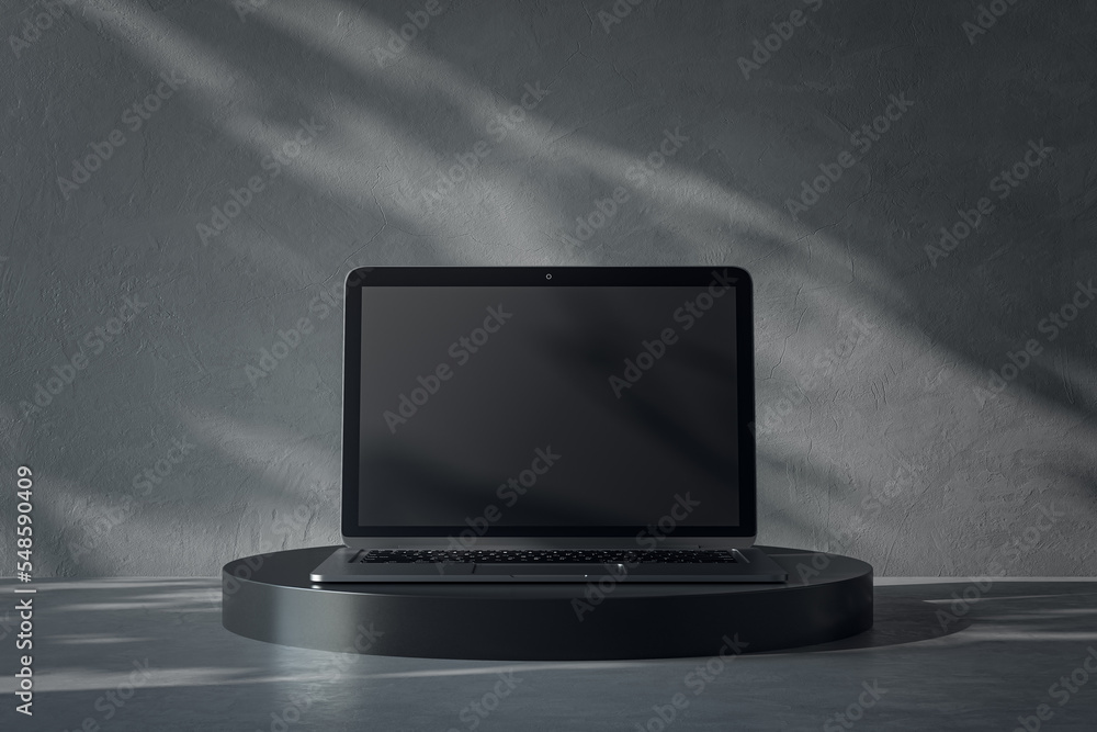 黑色现代笔记本电脑显示器屏幕正面视图，深色手套上有徽标或文字