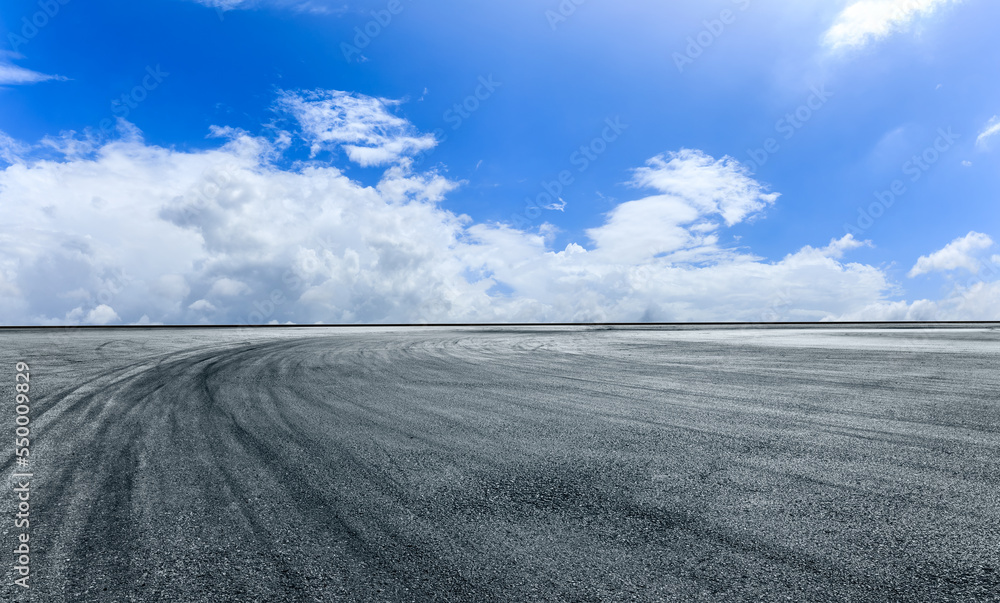 Empty asphalt road with sky clouds background