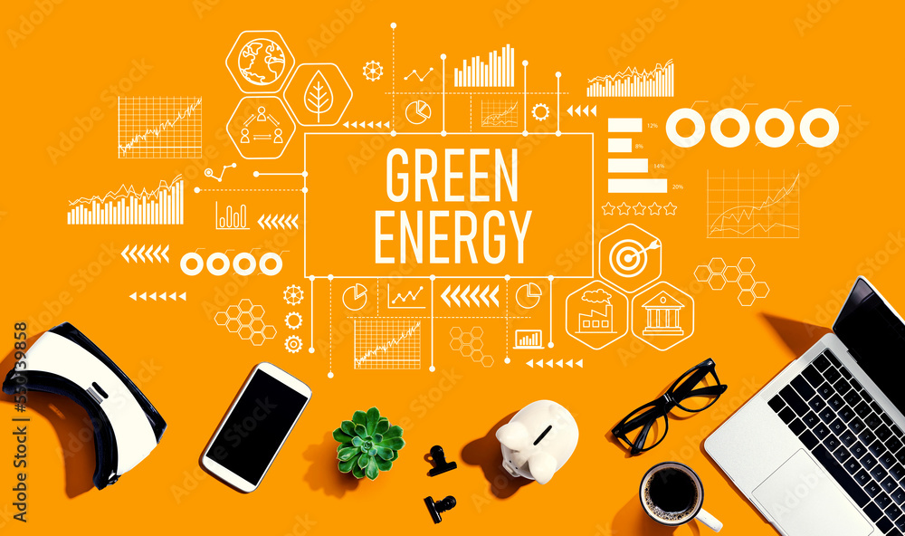 Green Energy concept with electronic gadgets and office supplies - flat lay