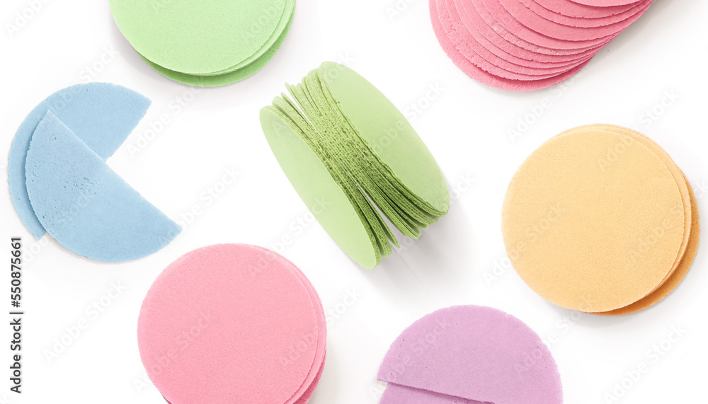 Creative layout made of wafers of different flavours and colours (pink, purple, green, blue, yellow)