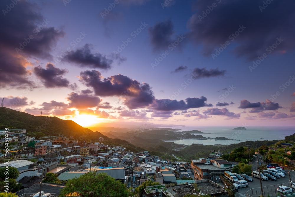 A village facing the sea and built on a mountain. A romantic sunset view. Jiufen Village, Ruifang Di
