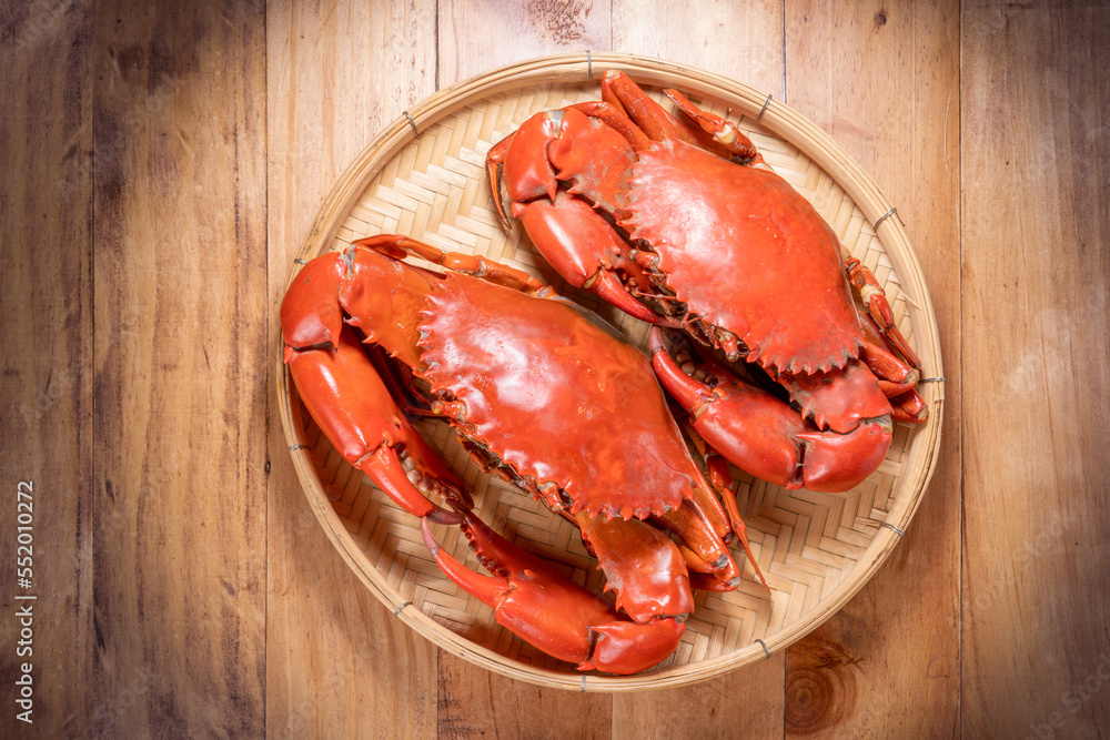 Steamed Red Crab seafood on wooden plate, Boiled Serrated mud crab on wooden plate on wooden backgro