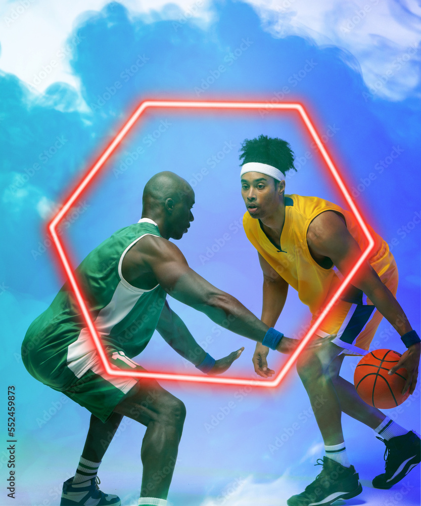 非裔美国篮球男运动员在烟雾背景下用发光的六边形运球