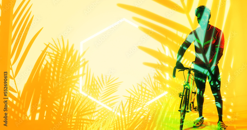 Illuminated hexagon and plants over african american male athlete standing with bike, copy space