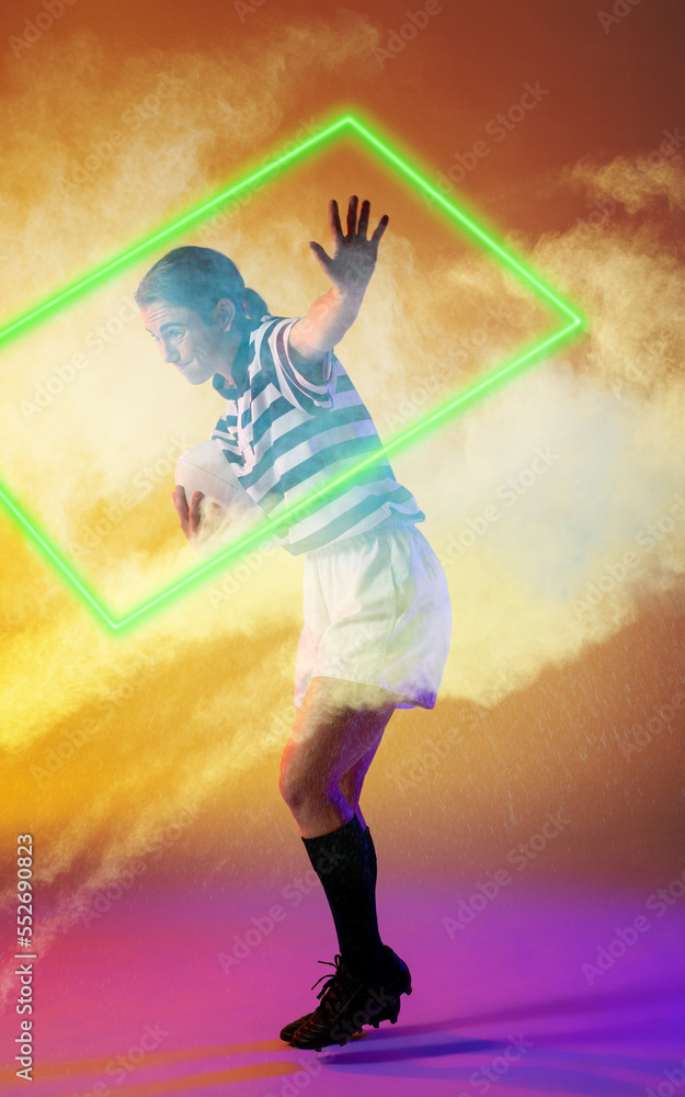 Caucasian female rugby player with ball showing stop sign by illuminated rectangle amidst smoke
