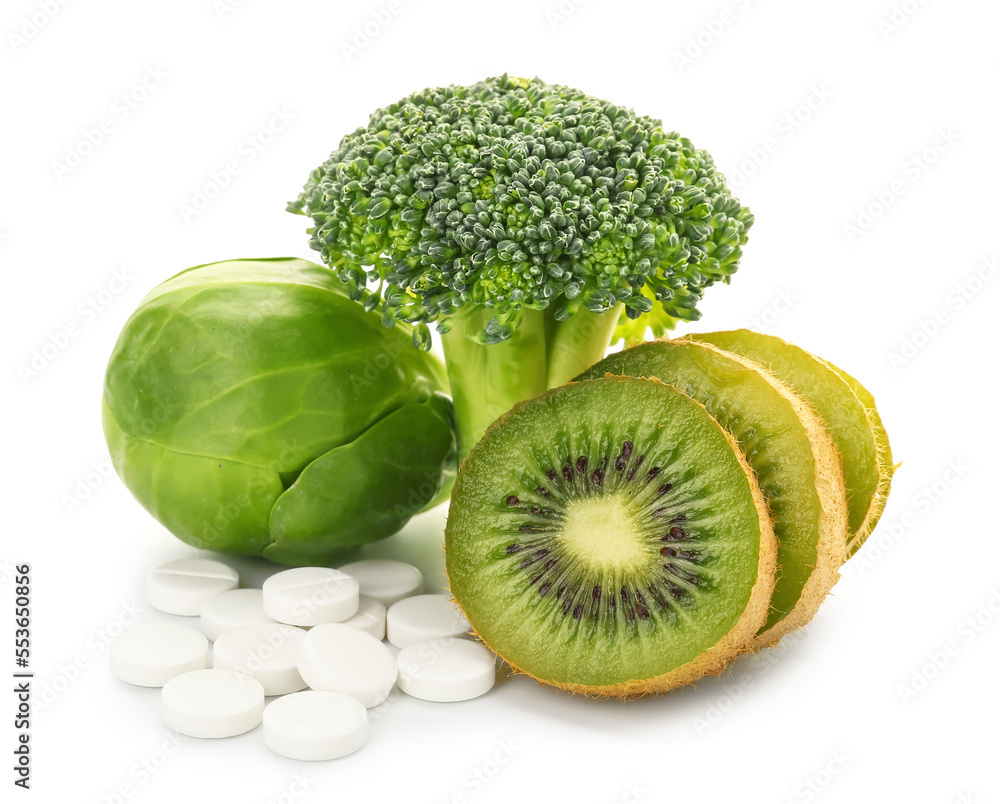 Healthy products and pills on white background