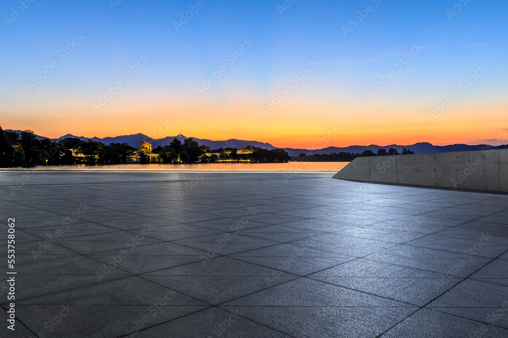 Empty square floor with sky cloud background at sunset
