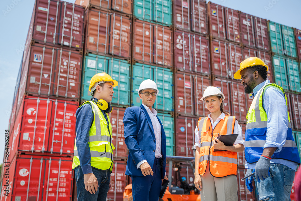 Worker and businessman checking containers data for export and import,Container loading Cargo freigh