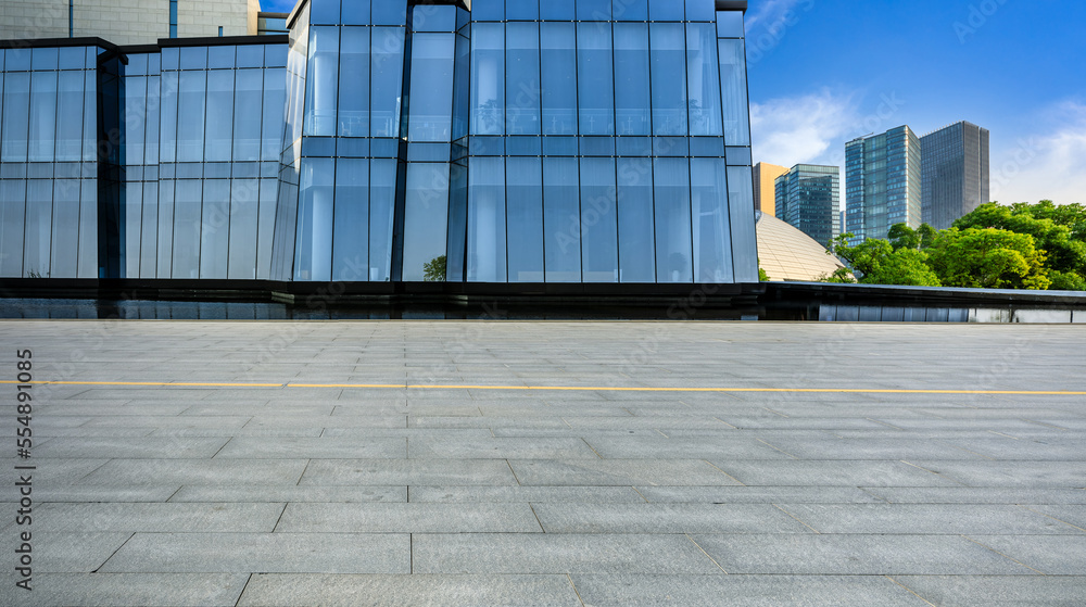Empty floor and glass wall with modern building in Hangzhou, Zhejiang Province, China.