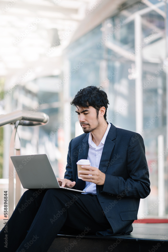 Positive Asian Entrepreneur Talking On Cellphone Using Digital Tablet During Coffee Break In City Ur