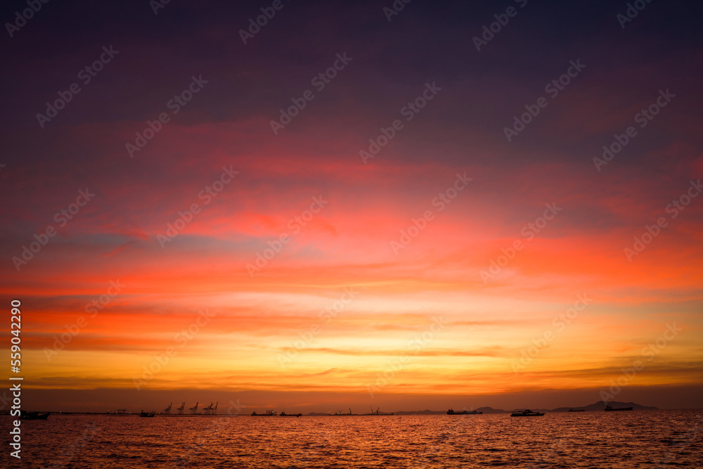 Sunset Colorful sunset at the sea. Romantic Sunet go down, blue and orange clouds flow in sky. Majes