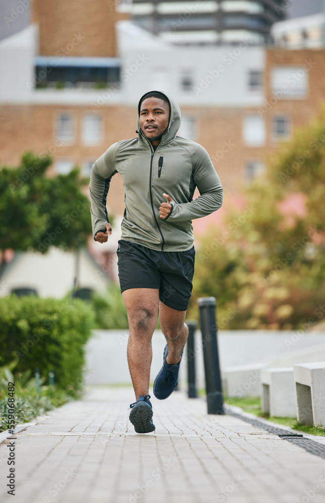 Fitness, exercise and black man running in city in winter for health, wellness and strength. Sports,
