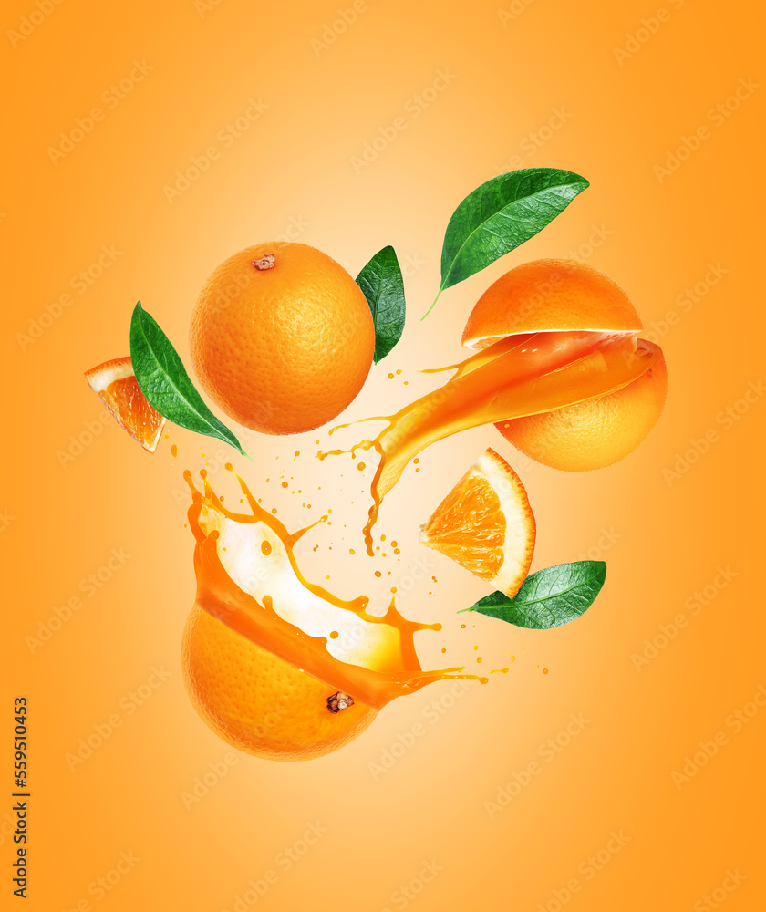 Whole and sliced oranges with juice splashes in the air on a yellow background