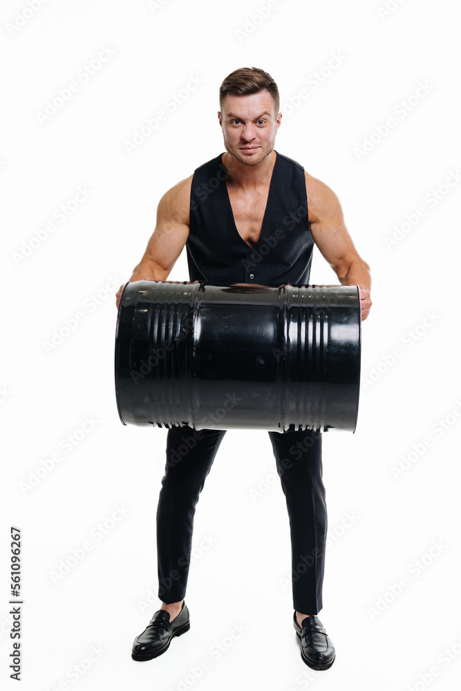 Handsome man with barrel on isolated white background. Young bodybuilder workout with barrel.